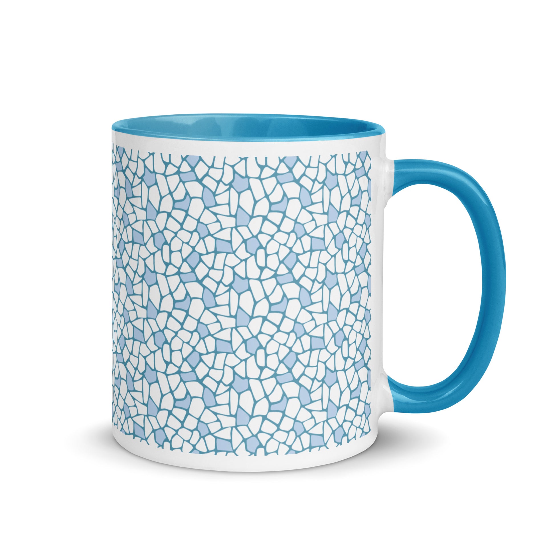 Weiße Keramiktasse mit blauem Giraffenmuster sowie blauem Henkel und Innenrand.